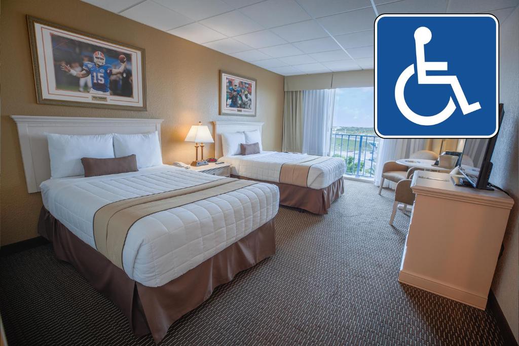 Postel nebo postele na pokoji v ubytování Stadium Hotel