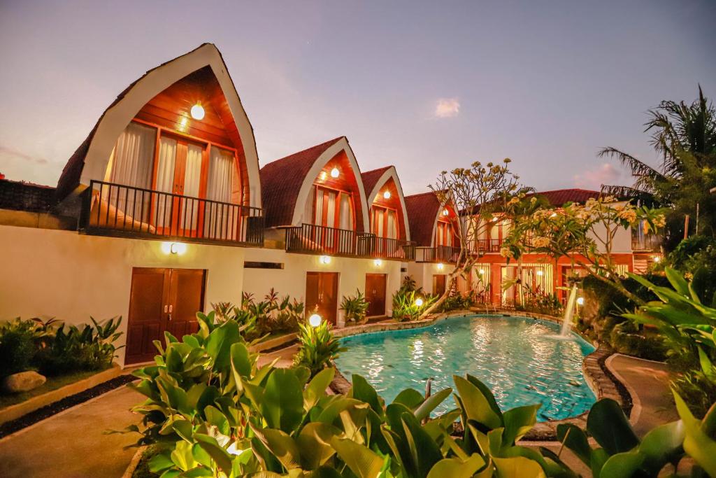 una imagen de una casa con piscina en Neo Bintang Bungalow Cafe and Pool, en Sanur