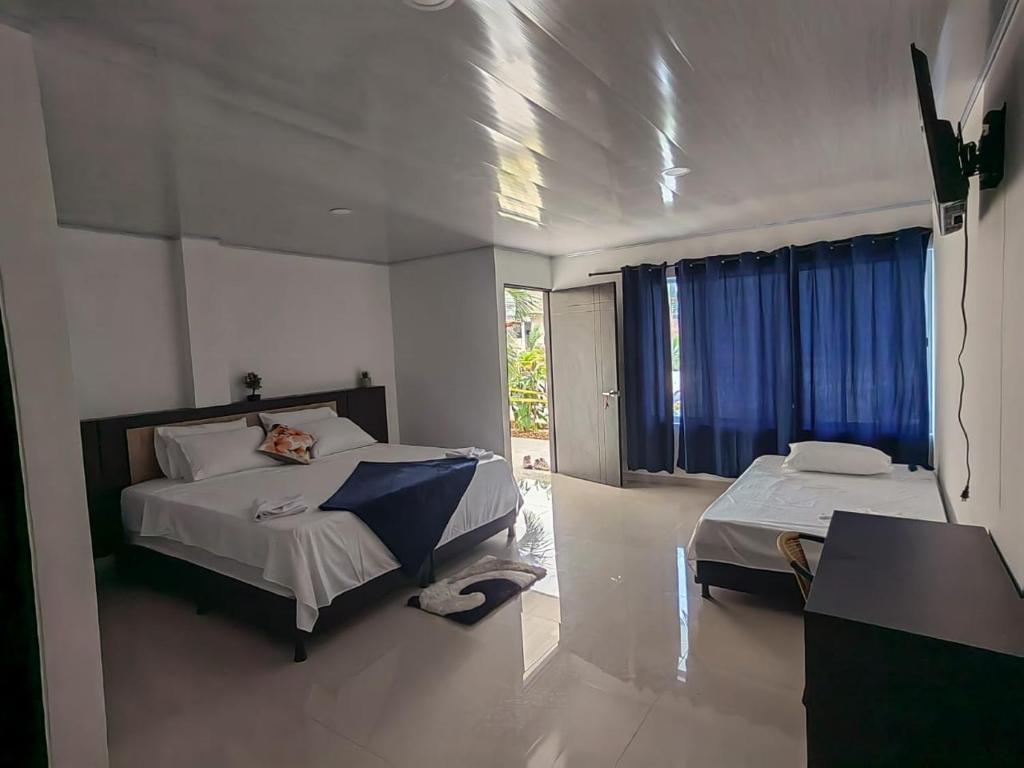 Säng eller sängar i ett rum på RIOPARK BEACH HOTEL
