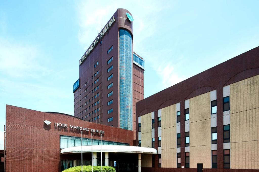 a building with a hotel in front of it at Hotel Marroad Tsukuba in Tsuchiura