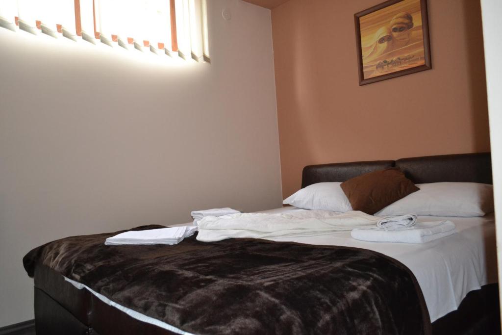 Postel nebo postele na pokoji v ubytování Guesthouse Vila DND