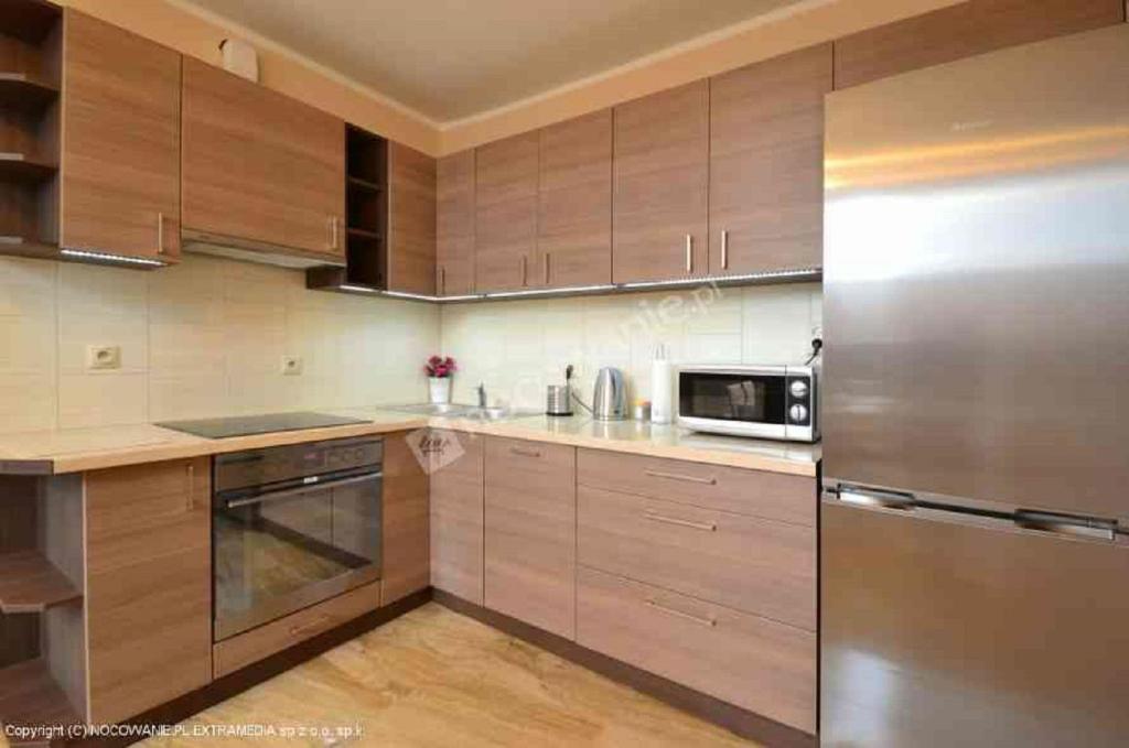 Kuchyňa alebo kuchynka v ubytovaní Apartamenty by Hanna