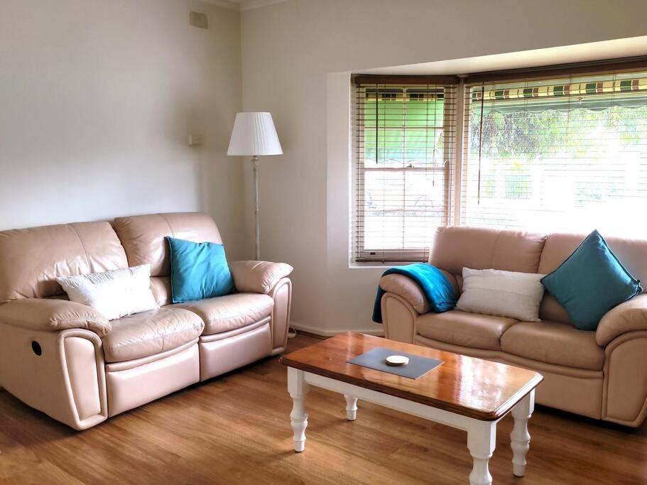 a living room with two couches and a coffee table at Prospect Place in Prospect