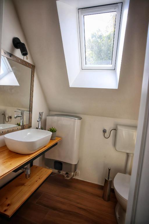 a bathroom with a sink and a mirror and a window at Kuća za odmor Miracool in Generalski Stol