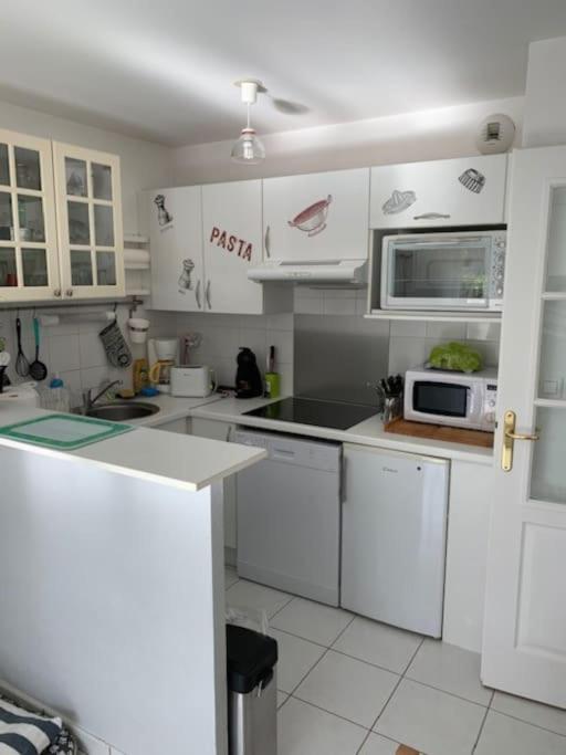 Kuchyň nebo kuchyňský kout v ubytování Superbe appartement En baie de Somme