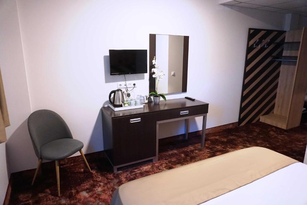 Postel nebo postele na pokoji v ubytování Hotel Ihtiman