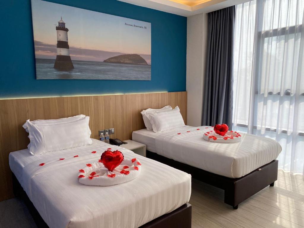 Postel nebo postele na pokoji v ubytování Lighthouse Hotel Semporna