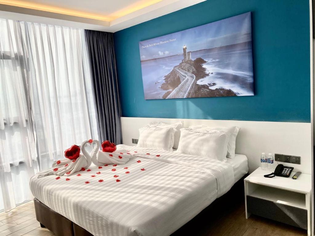 Postel nebo postele na pokoji v ubytování Lighthouse Hotel Semporna