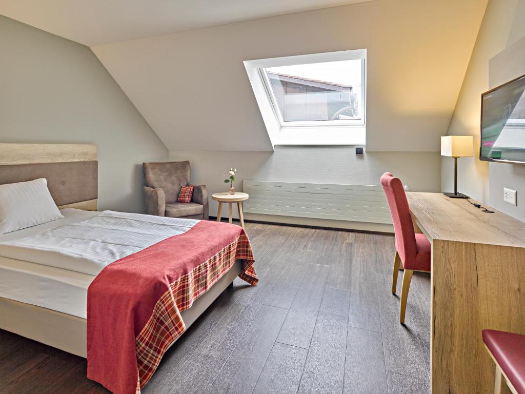 Voodi või voodid majutusasutuse Restaurant & Hotel Heidelberg toas