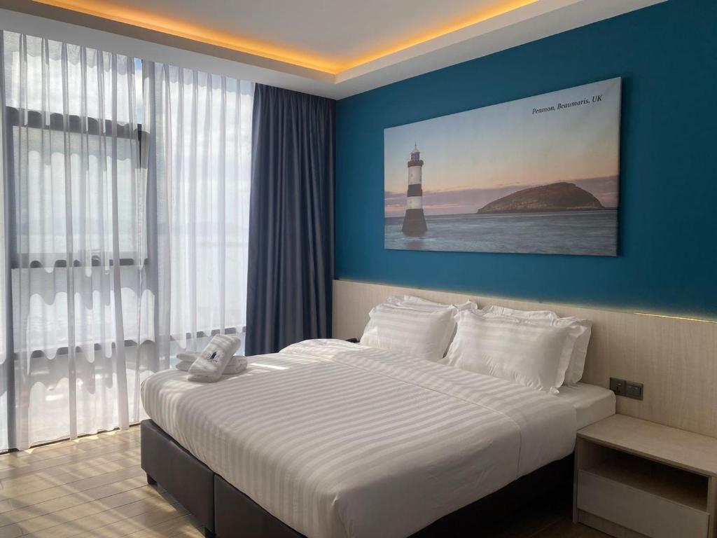 Postel nebo postele na pokoji v ubytování Lighthouse Hotel Semporna