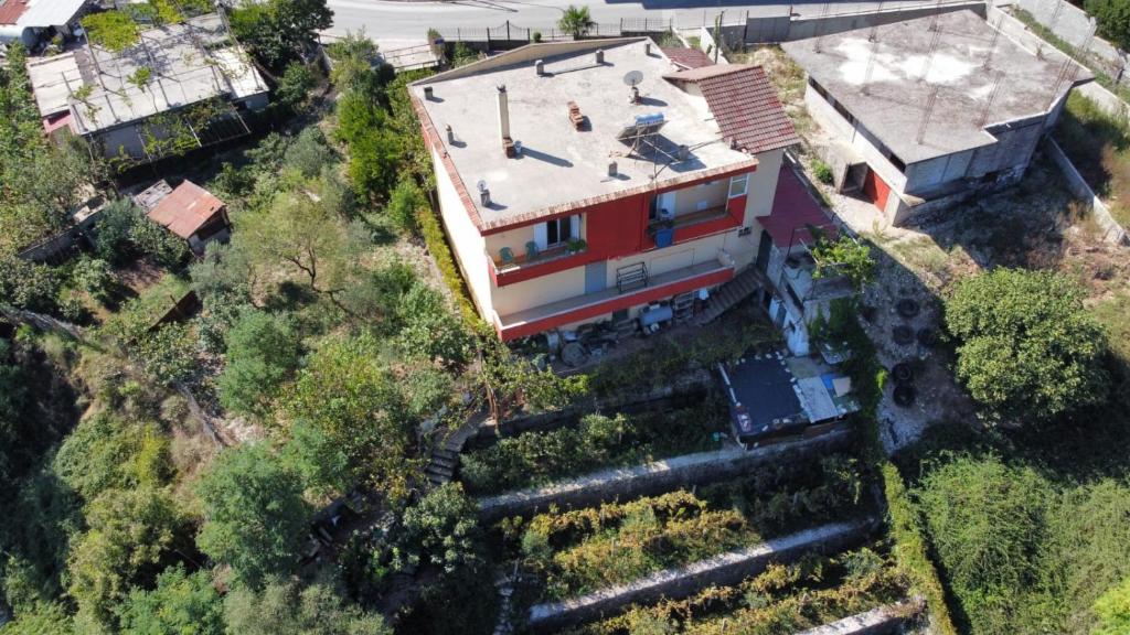 an aerial view of a house on a hill at GuestHouseMantho in Gjirokastër