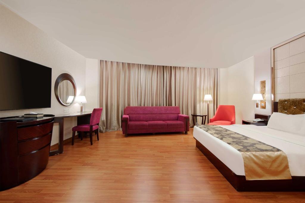 Postel nebo postele na pokoji v ubytování Foshan Guanxin Hotel