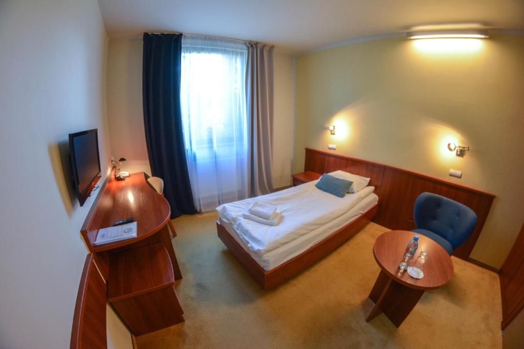 Postel nebo postele na pokoji v ubytování Hotel Neo