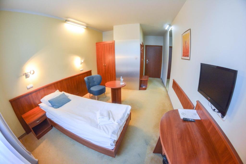 TV a/nebo společenská místnost v ubytování Hotel Neo