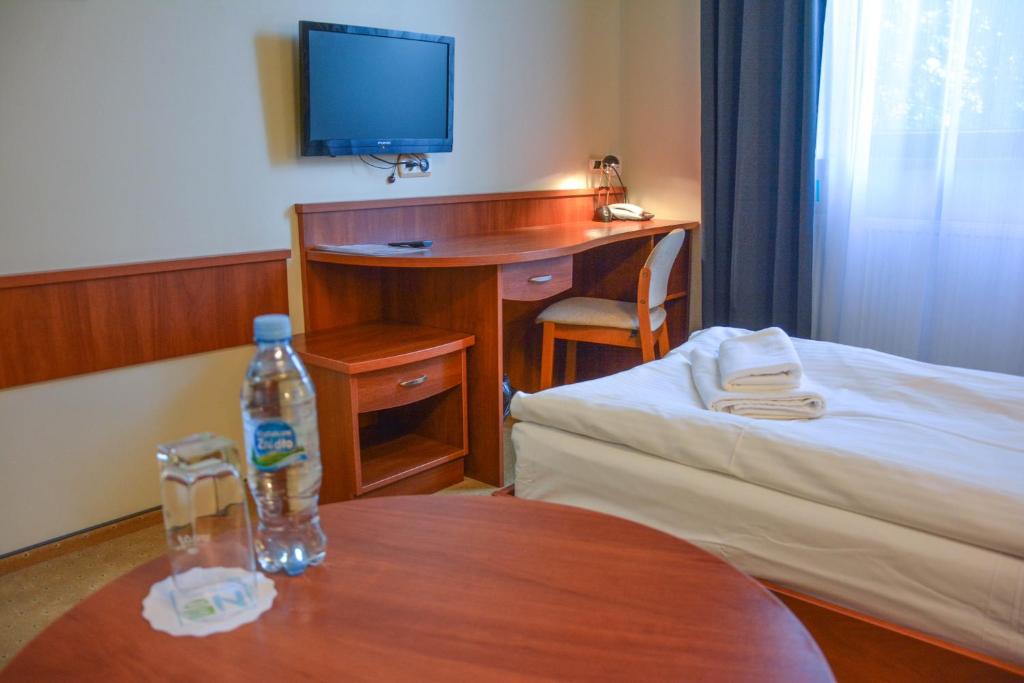 Postel nebo postele na pokoji v ubytování Hotel Neo