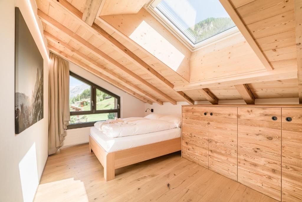 Cama o camas de una habitación en Haus Beta by Zermatt Premium Apartments
