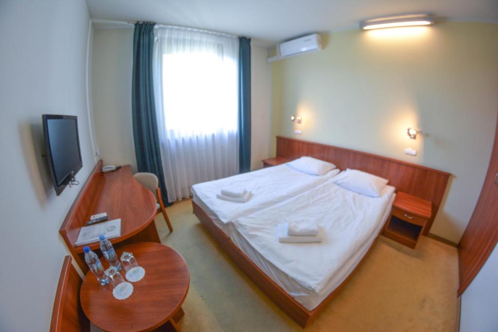 Postel nebo postele na pokoji v ubytování Hotel Neo