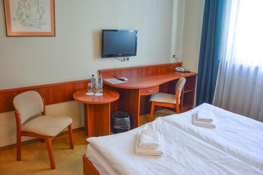 Postel nebo postele na pokoji v ubytování Hotel Neo