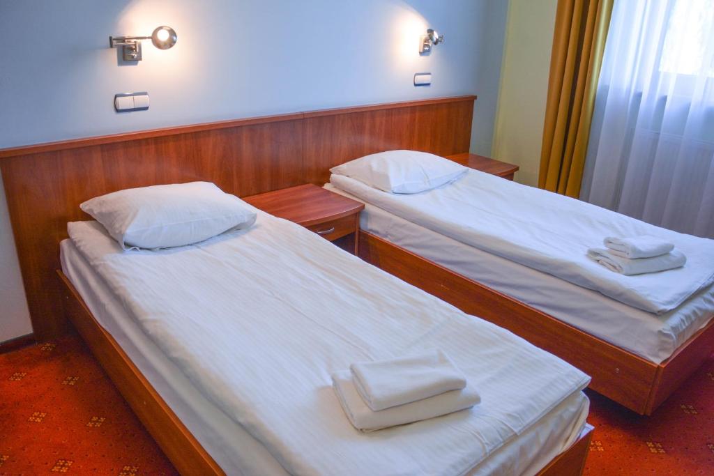 Postel nebo postele na pokoji v ubytování Hotel Neo