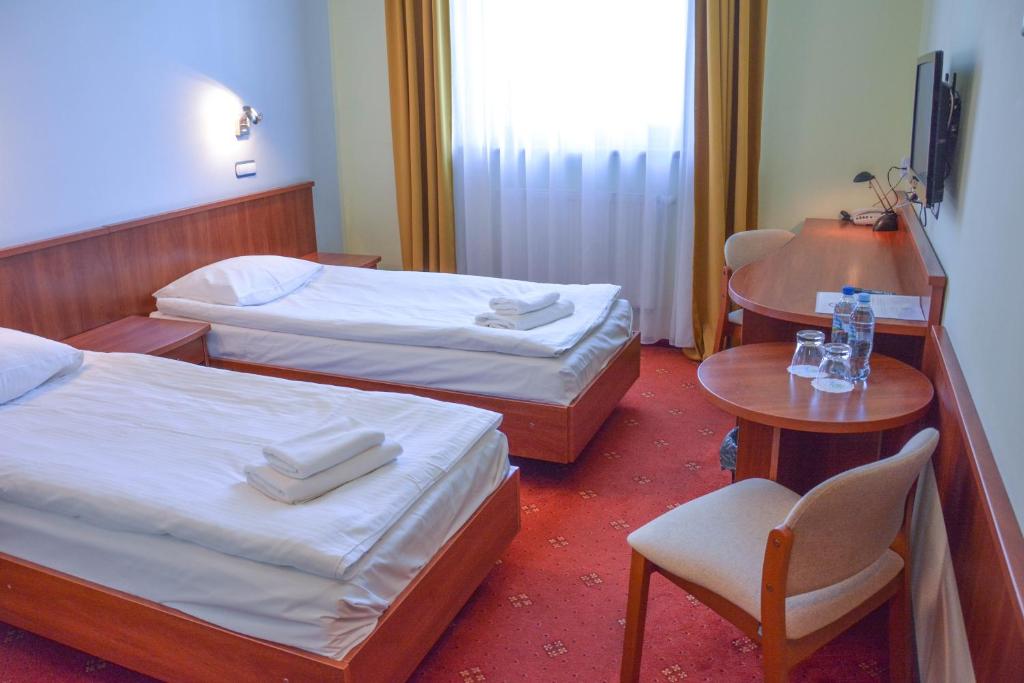 Postel nebo postele na pokoji v ubytování Hotel Neo