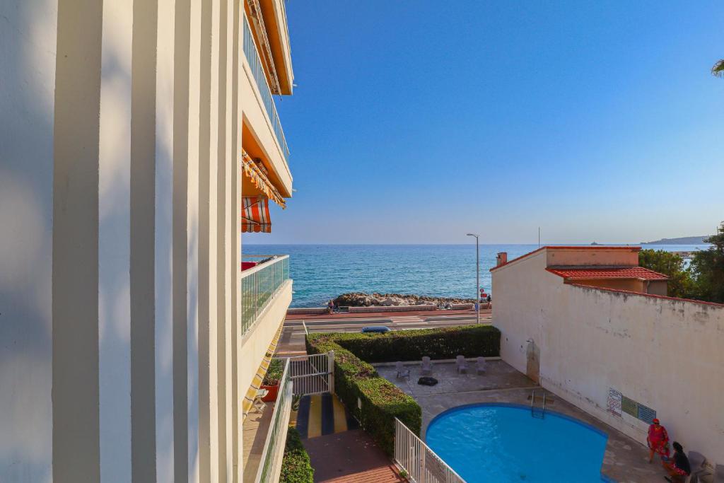 a view of the ocean from a building at « Hawai » Proche Mer, Calme, Piscine in Menton