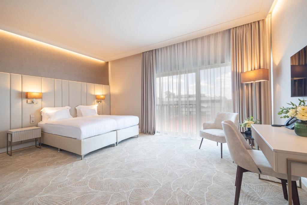 Postel nebo postele na pokoji v ubytování Hotel Gerardus