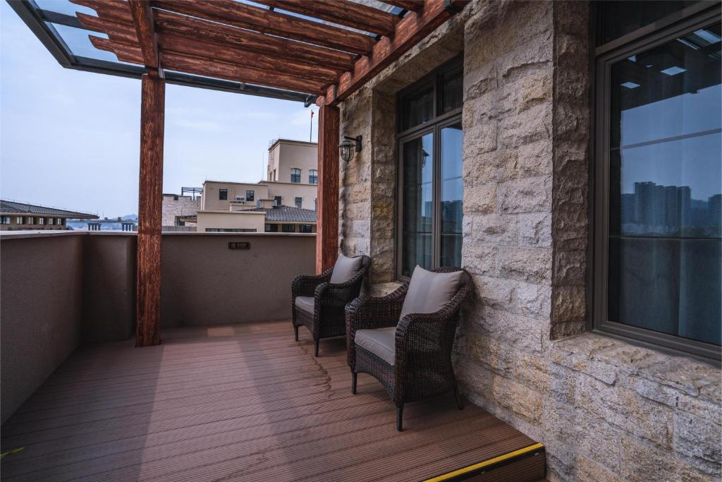 Balkón nebo terasa v ubytování Guangzhou Nansha Stone Inn