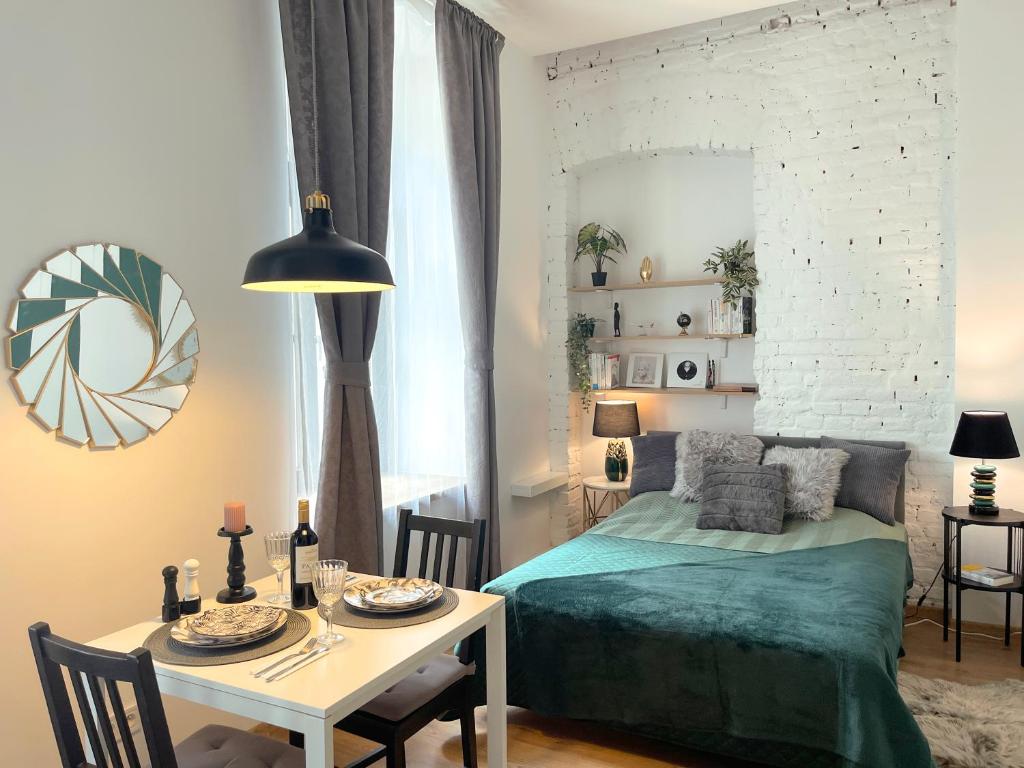 Posteľ alebo postele v izbe v ubytovaní Piotrkowska122 Studio Apartments
