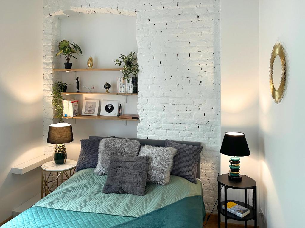 Posteľ alebo postele v izbe v ubytovaní Piotrkowska122 Studio Apartments