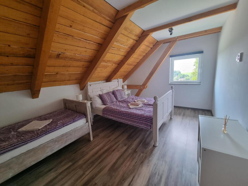 Postel nebo postele na pokoji v ubytování Čenovický dvůr