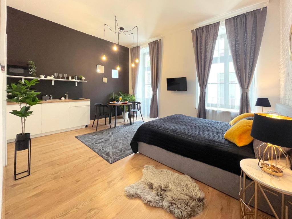 Posteľ alebo postele v izbe v ubytovaní Piotrkowska122 Studio Apartments