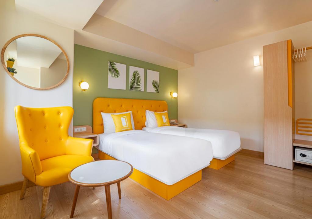 Postel nebo postele na pokoji v ubytování Bloom Hotel - Sector 19