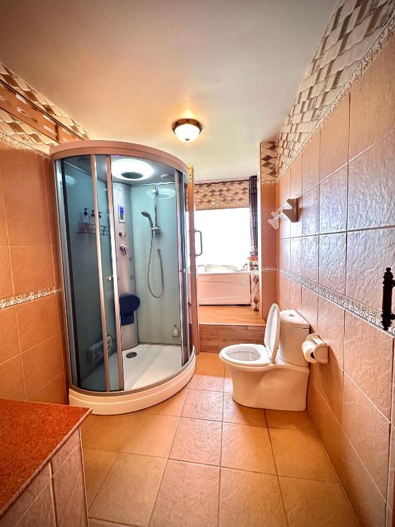 Koupelna v ubytování ดอยหมอกดอกไม้รีสอร์ท DoiMok DokMai Resort