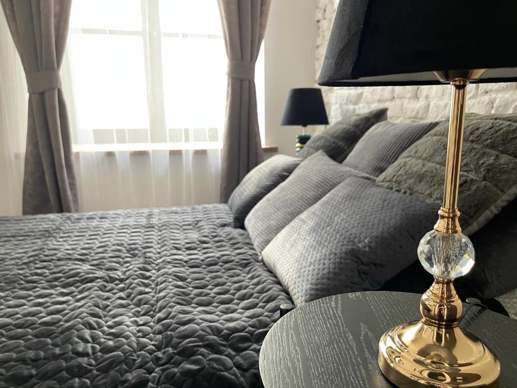 Posteľ alebo postele v izbe v ubytovaní Piotrkowska122 Studio Apartments