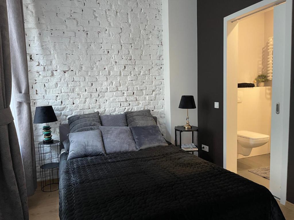 Posteľ alebo postele v izbe v ubytovaní Piotrkowska122 Studio Apartments