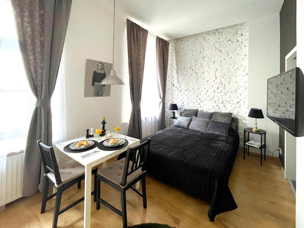 Posteľ alebo postele v izbe v ubytovaní Piotrkowska122 Studio Apartments