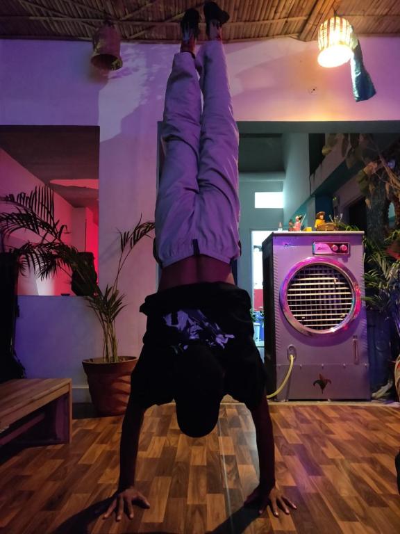 a person laying on their back on the dance floor at Pachamama in Jaipur
