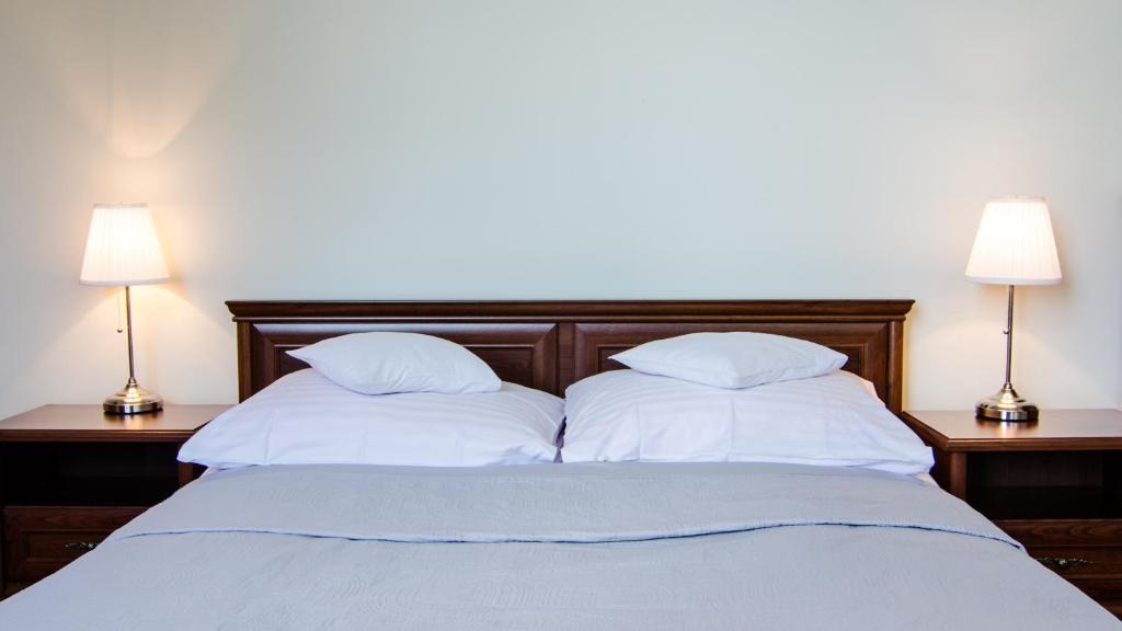 Posteľ alebo postele v izbe v ubytovaní Hotel Łazienkowski