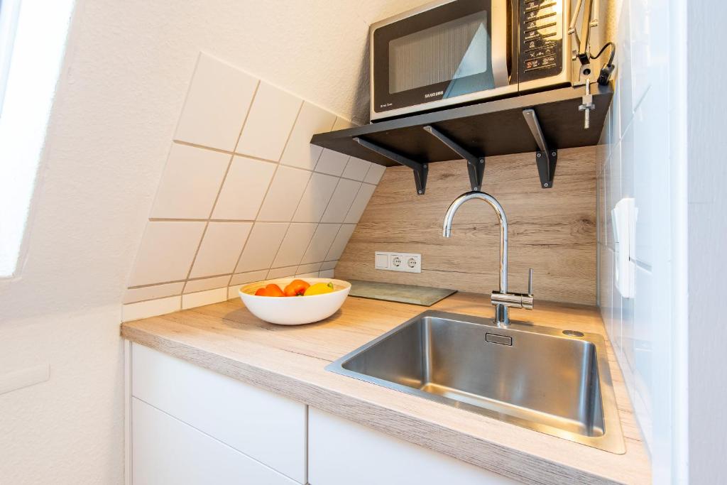 Kuchyň nebo kuchyňský kout v ubytování Steger-Hüs Wohnung 26