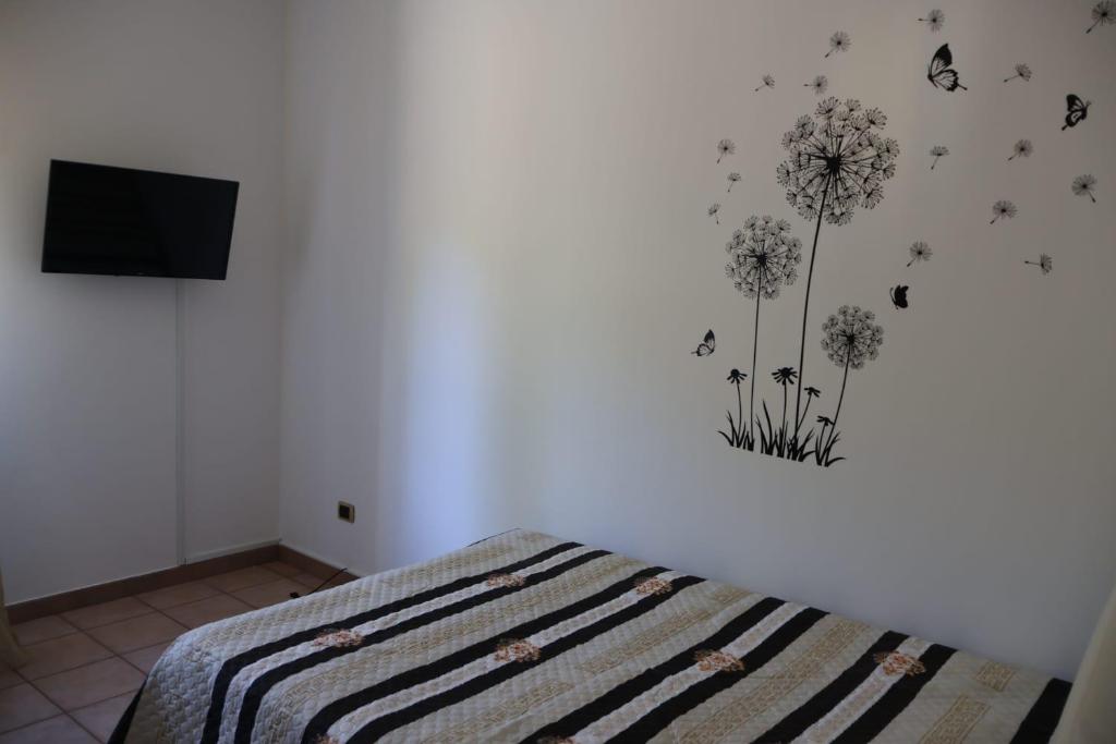 Postel nebo postele na pokoji v ubytování B&b Mamì