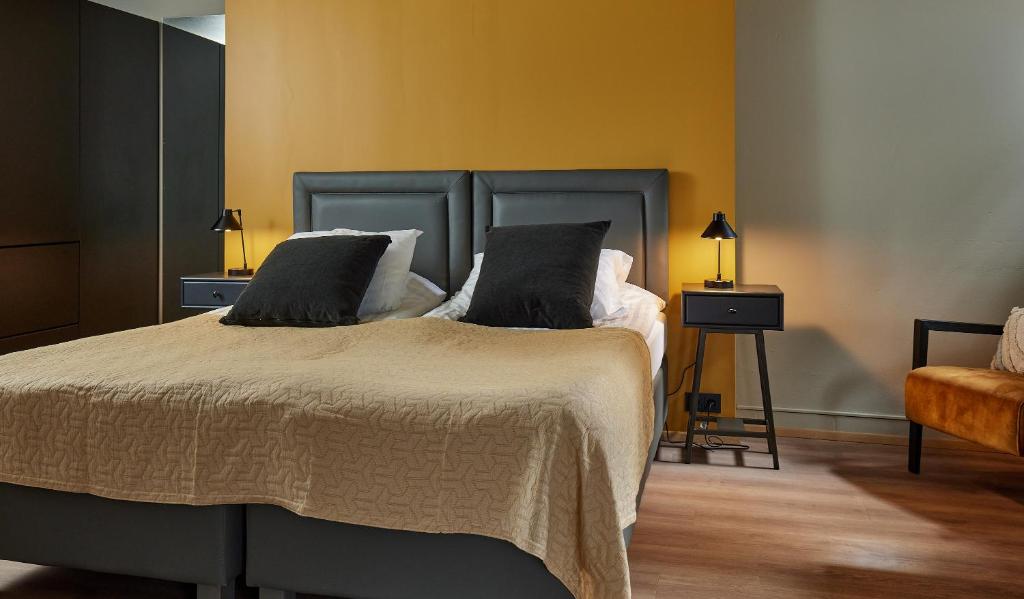 Postel nebo postele na pokoji v ubytování Hotel Frón