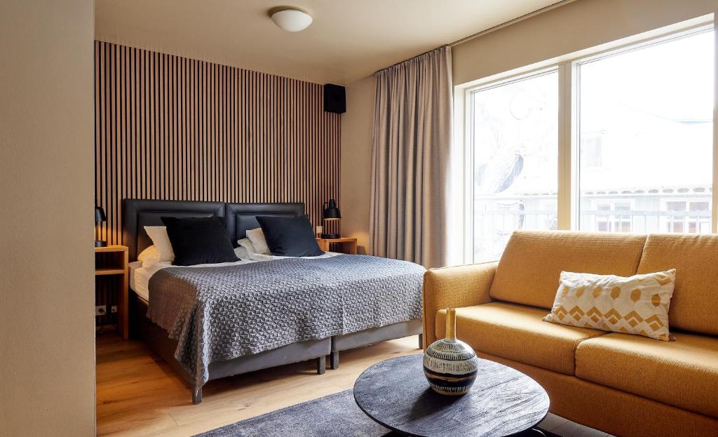 Postel nebo postele na pokoji v ubytování Hotel Frón