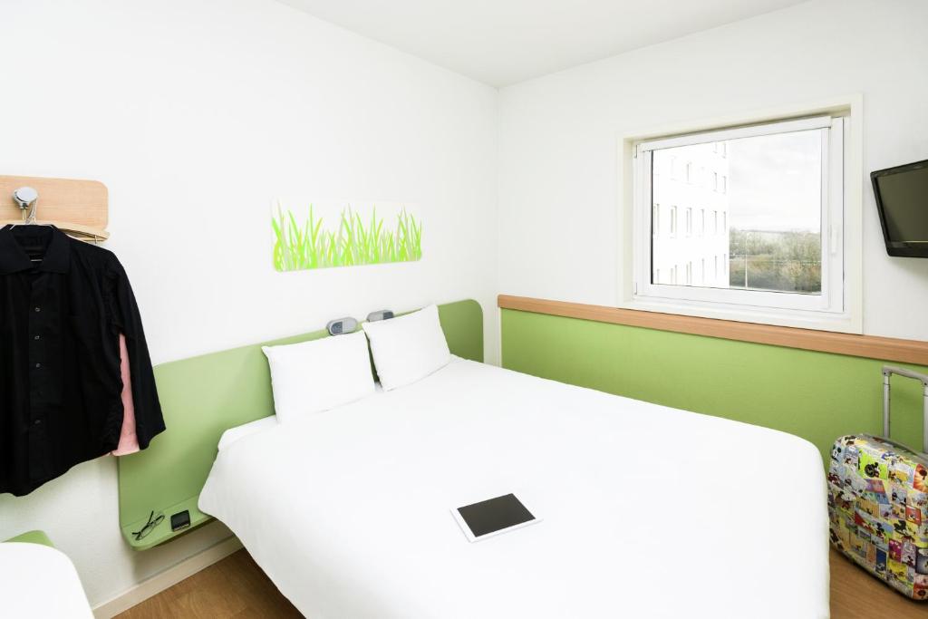 Postel nebo postele na pokoji v ubytování ibis Budget Luxembourg Sud