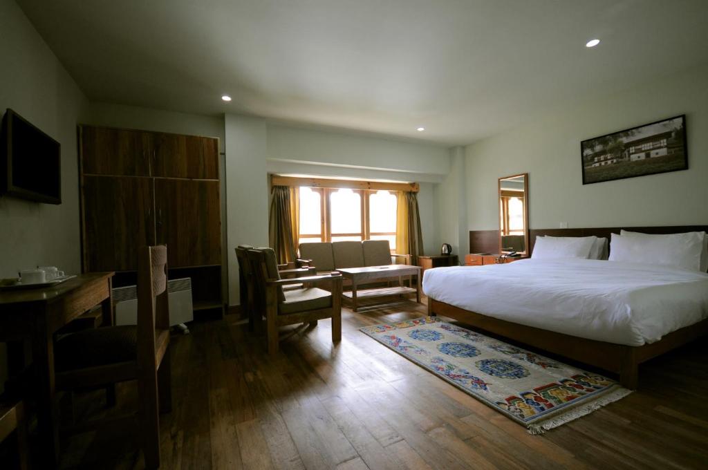 Postel nebo postele na pokoji v ubytování Hotel Amodhara