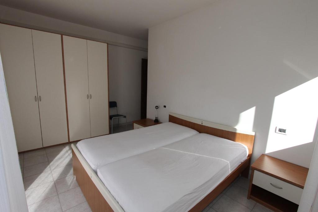 Postel nebo postele na pokoji v ubytování Residences La Rustica & Elite