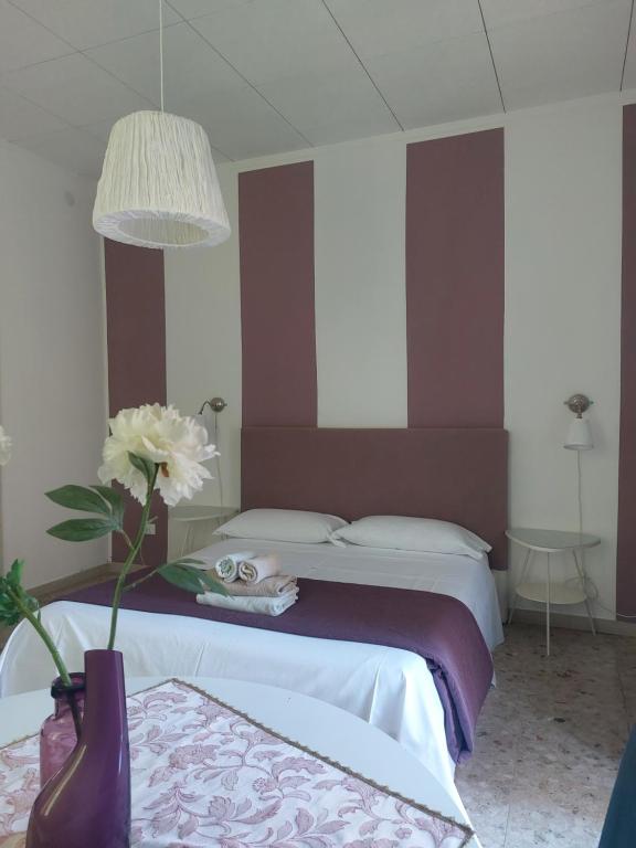 Postel nebo postele na pokoji v ubytování Giove Rooms