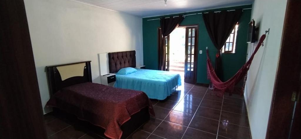 Katil atau katil-katil dalam bilik di Sitio recanto Feliz