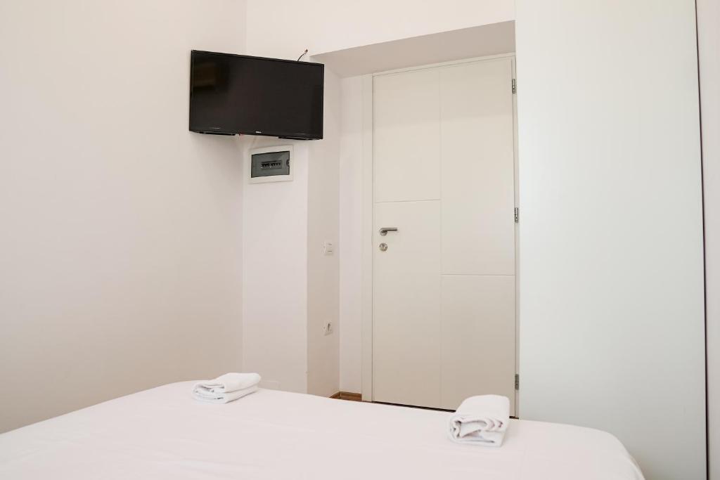 Uma cama ou camas num quarto em Mega Hotel