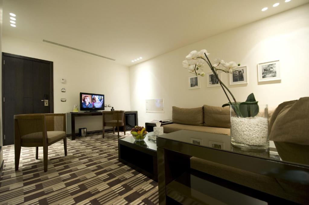 TV a/nebo společenská místnost v ubytování Hotel Cavalier