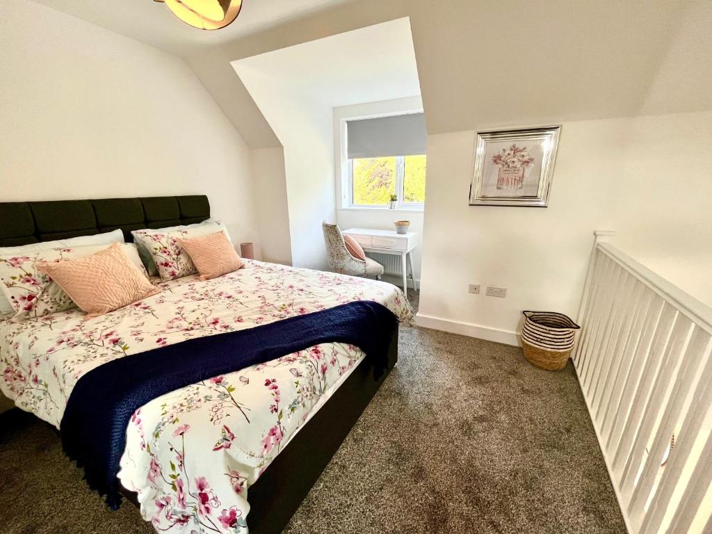 a bedroom with a bed and a window at Salford Townhouse 3 BR Home in Manchester